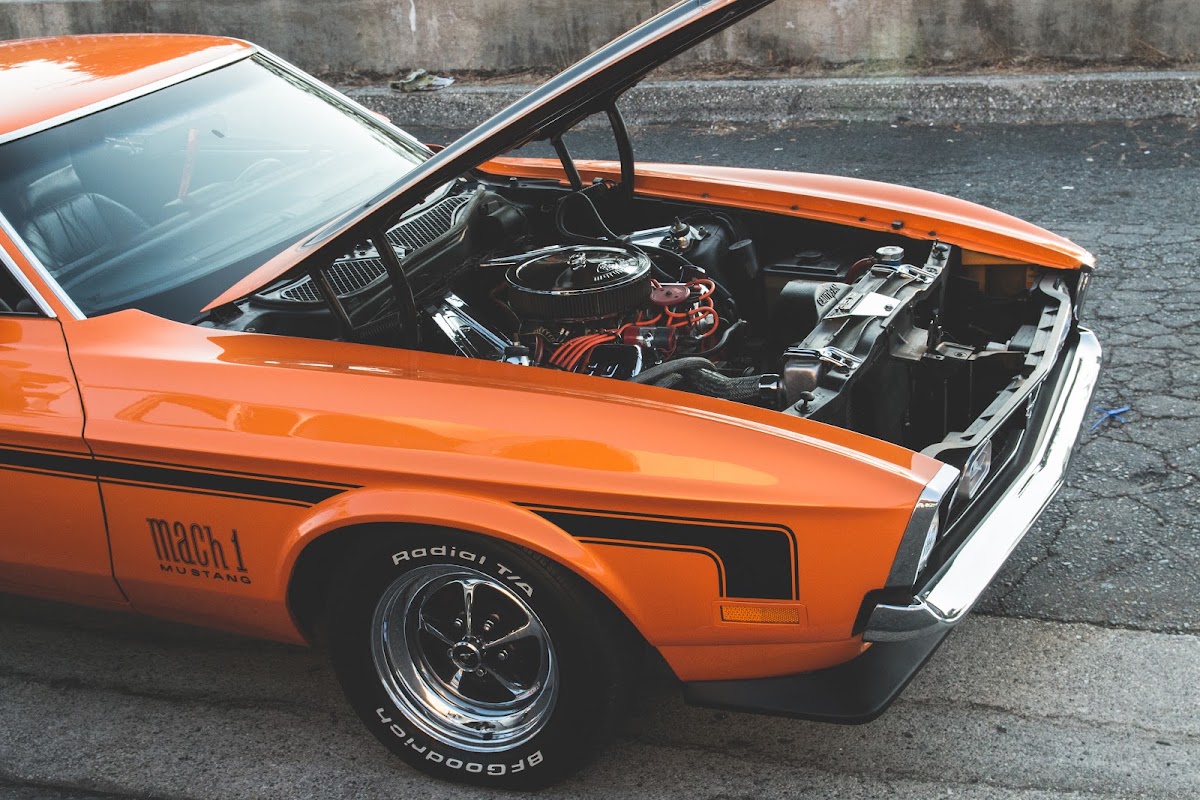 Orange Mustang Mach 1 with the bonnet up